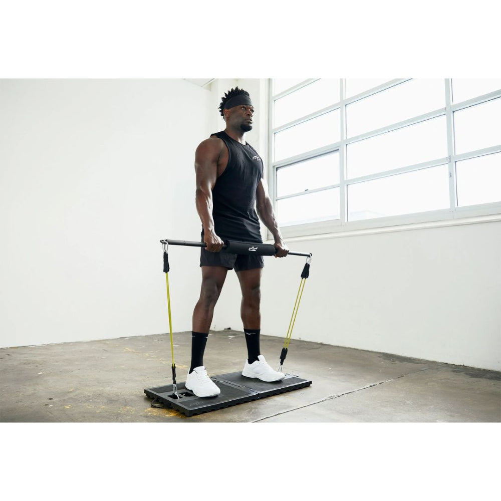 PTP Resistance Platform in use for a squat exercise with resistance tubes
